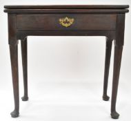 An early George III mahogany tea table with one frieze drawer, on tapering legs with pad feet,