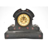 A black slate dome topped clock with side brackets, on a plinth, inlaid with red stone accents,