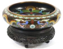 A cloisonne bowl on stand, decorated with dragons chasing the pearl on a black ground,