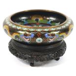 A cloisonne bowl on stand, decorated with dragons chasing the pearl on a black ground,