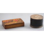 A composition two piece round form snuff box set to the top and base with panels commemorating