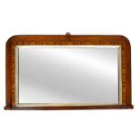 A wood framed overmantle mirror, of small rectangular form, with curved top corners,