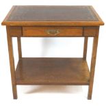 An oak library table with leather inset top, of plain rectangular form,