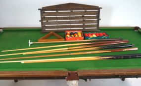 An early 20th century slate bed half size snooker table on an oak base with baluster turned legs,