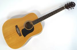 An Ariana acoustic guitar,
