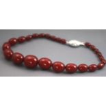 A single strand of graduated cherry beads.
