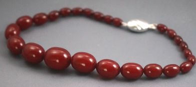 A single strand of graduated cherry beads.