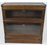An oak Globe Wernicke & Co bookcase, with two tiers, glazed and hinged doors,