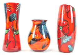 A Poole pottery flared form poppy pattern vase with slant cut top, 24cm high,