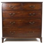 A George III mahogany chest of two short and three long drawers with brass swan neck handles