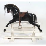 An Edwardian black painted wood rocking horse, early 20th century,