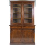 A Victorian mahogany display cabinet with plain cornice above two glazed doors