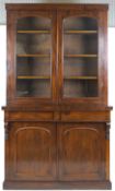 A Victorian mahogany display cabinet with plain cornice above two glazed doors