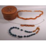 A collection of three beaded necklaces.