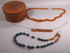 A collection of three beaded necklaces.