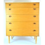 A 1950's retro vintage Avalon chest of five graduating drawers, raised on tapered legs,