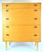 A 1950's retro vintage Avalon chest of five graduating drawers, raised on tapered legs,