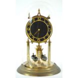 A German (Kieninger und Obergfell) 400 day torsion clock, in gilt finish with a black Arabic dial,