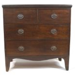 A 19th century oak chest of drawers, with two short drawers above two long graduated drawers,