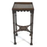 A George III mahogany kettle stand, the galleried square top with a carved acanthus scroll frieze,