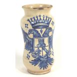 A Continental pottery Albarello jar, cobalt decorated with an armorial achievement with a tower,