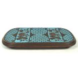 A 19th century mahogany and bead work kettle stand of rounded rectangular form the turquoise panel