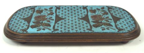 A 19th century mahogany and bead work kettle stand of rounded rectangular form the turquoise panel