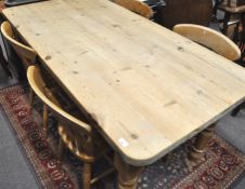 A 20th century pine farmhouse table, of rectangular form along with a set of our matching chairs,