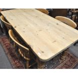 A 20th century pine farmhouse table, of rectangular form along with a set of our matching chairs,