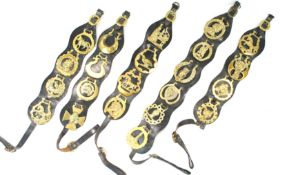 A large group of leather backed late 19th/early 20th century horse brasses (22)