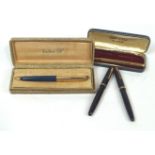 A boxed gilt finish Parker 51 fountain pen with two others and a gilt yard-o-lead pencil