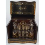 A 19th century ebonised wood and rosewood liqueur cabinet, inlaid with brass,