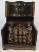 A 19th century ebonised wood and rosewood liqueur cabinet, inlaid with brass,