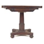 A late 19th century Victorian mahogany card table having a folding felt top with carved and