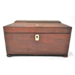 A William IV rosewood sarcophagus shaped tea caddy, the top inlaid with mother of pearl,