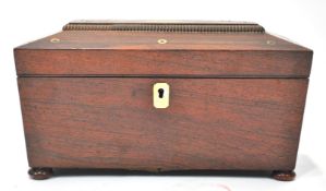 A William IV rosewood sarcophagus shaped tea caddy, the top inlaid with mother of pearl,