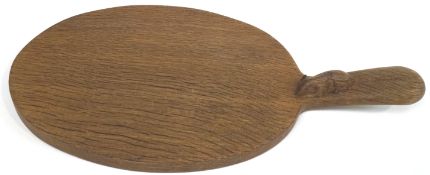 An oak Robert 'Mouseman' Thompson of Kilburn chopping board, of oval paddle form,