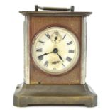 A19th century base metal carriage style clock with round Roman dial and glass side panels