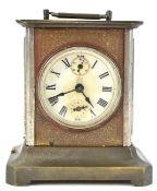 A19th century base metal carriage style clock with round Roman dial and glass side panels