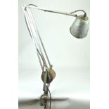 A mixed metal angle poise lamp with counter balance weight and a clamp base by Hardrill & Horstman,
