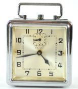 A German (HAC) chrome alarm clock, of squared form with top strap handle,