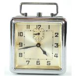 A German (HAC) chrome alarm clock, of squared form with top strap handle,