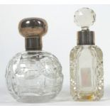 A cut glass globe scent bottle with pull off silver cap, 11cm high,
