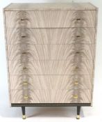 A Retro chest of drawers, of plain rectangular form, finished in melamine,