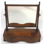 A 19th century mahogany swing frame mirror with double bow fronted drawers on turned feet,