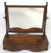 A 19th century mahogany swing frame mirror with double bow fronted drawers on turned feet,