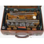 A gentleman's brown mock crocodile leather travelling case,