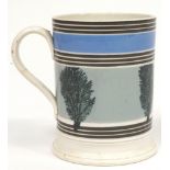 A Staffordshire pottery mocha ware cylindrical mug, mid 19th century,