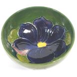 A Moorcroft 'Clematis' pattern small green ground bowl, impressed marks,