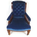 A 19th century Victorian mahogany library reading chair, with buttoned back rest, turned arm rest,